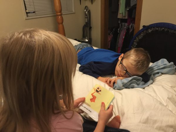 Max had to come home early from school because he wasn't feeling well, and Sydney decided to read to him while he laid in bed. 